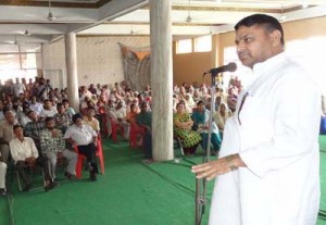 Congress MP Madan Lal Sharma addressing public meeting at Maralian in R S Pura on Sunday.