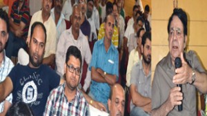 Chairman Legislative Council Amrit Malhotra addressing traders at Vir Marg Road on Wednesday.