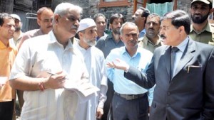 Speaker Legislative Assembly Mubarak Gul interacting with officers during his visit to Eidgah Constituency on Tuesday.