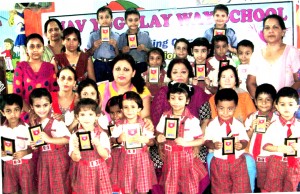 Winners of Story Telling Competition organized by Nav Yug Play Way School in Jammu on Tuesday.