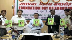 Director, Council for Social Development Dr T Haq, Commissioner Secy Agriculture Production Dr Asgar Samoon and others releasing a souvenir on the occasion of NABARD Foundation Day on Friday. -Excelsior/Rakesh