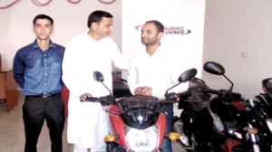 Minister for PHE, Sham Lal Sharma at Yamaha showroom.