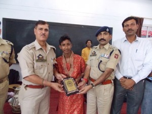 SSP Kathua Mohan Lal and Principal PTS Kathua R K Bhat feliciltating young singer Satinder Sharma.