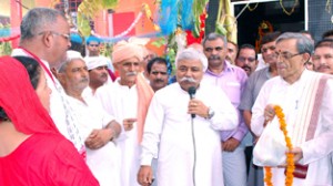 Minister for Planning, Ajay Kumar Sadhotra addressing devotees on Sunday.