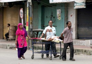 A patient being taken for tests outside Medical College Jammu on a trolley during curfew on Tuesday. —Excelsior/Rakesh
