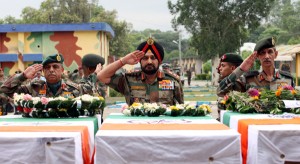 Army chief Gen Bikram Singh, Northern Army Commander Lt Gen Sanjiv Chachra and GOC 16 Corps Lt Gen D S Hooda paying tributes to martyrs at Technical Airport in Jammu on Wednesday. (Another pic on page 4)