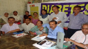 Dr Jitendra Singh examining patient at a diabetes camp held at Kathua on Thursday.