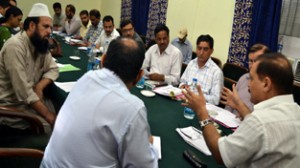 Commissioner Secretary PHE, Irrigation and Flood Control, Dr Pawan Kotwal chairing a meeting at Doda on Saturday.