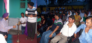 SS Ghuman, Commandant, 160 Bn CRPF, lighting the traditional lamp during inaugural function of Sainik Sammelan at Jammu.
