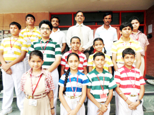 Medal winners in skating posing for a group photograph alongwith Principal, Jodhamal Public School on Thursday.