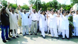 Students of GHSS Jagti along with their parents protesting against shortage of teachers in the school on Saturday.