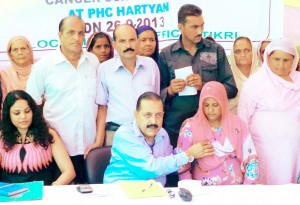 Dr Jitendra Singh examining a patient at Diabetes camp held at village Hartaryan of district Udhampur on Thursday.