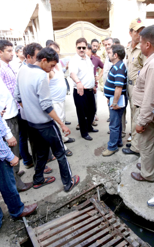 JMC Commissioner Kiran Wattal inspecting a site during sanitation drive on Saturday.