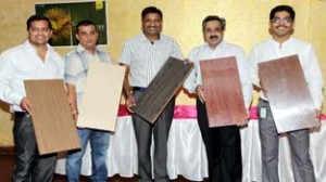 Officials of Greenply Industries showcasing their products at dealers meet at Jammu.