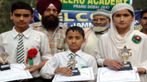 Winners of debate competition posing for a photograph alongwith officials on Monday.