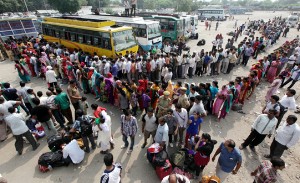 Huge rush of passengers with long queues at SRTC booking counter at Jammu Railway Station on Monday. -Excelsior/Rakesh