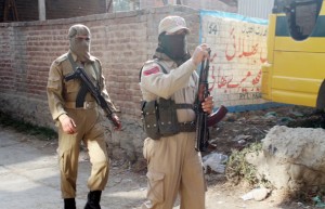 Police personnel patrolling Koli area of Pulwama on Friday. —Excelsior/Amin War
