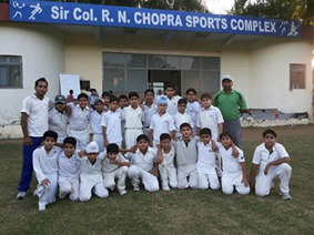 Winners Academy Yellow team posing for a group photograph alongwith their counterparts and coaches in Jammu on Friday.