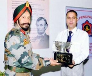Principal APS Srinagar Sandeep Marhatta receiving the Academic Excellence Trophy from Lt. Gen HJS Sachdev SM Chief of Staff Northern Command.