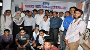 Students from Govt schools selected for computer training programme posing for photograph.