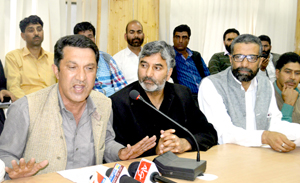 President JCC Abdul Qayoom Wani along with senior employee leaders addressing a press conference in Srinagar on Saturday. -Excelsior/Amin War