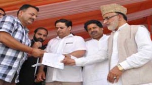Minister for Panchayati Raj, Ali Mohd Sagar, Minister for Housing Raman Bhalla and MoS RDD, Vikar Rasool during a function at Parade Ground on Wednesday.