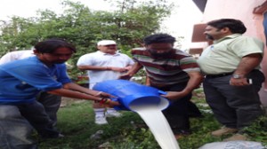 JMC team destroying adulterated milk in Jammu city.