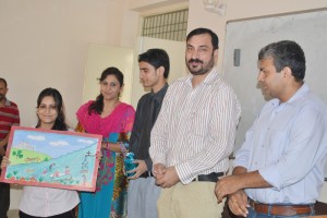 Incharge Director SHTM Dr Parikshat Singh Manhas distributing prize to a winner of Tourism Day competition.