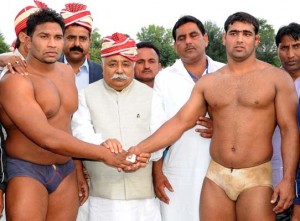 Minister for Labour, Planning & Development, Ajay Sadhotra declaring winner during Wrestling Competition in Jammu.