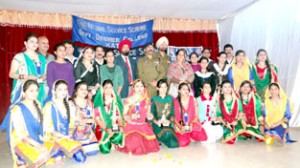 Students in colourful dresses posing alongwith the dignitaries during Valedictory Function at GDC Kathua.