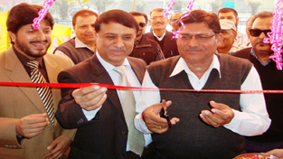 M L Mir and C L Gandhi inaugurating PNB branch at Vijaypur on Monday.