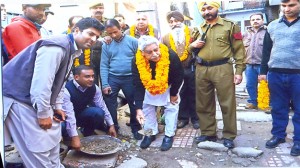 Former MP, Janak Raj Gupta laying foundation stone of construction work at Christian Colony on Monday.