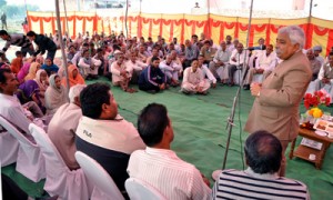 Minister for Planning Ajay Kumar Sadhotra addressing public gathering at Marh on Wednesday.