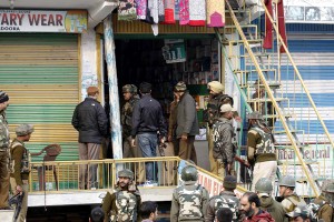 Security personnel looking for clues at Chadoora in Budgam district where militants shot dead a Station House Officer on Monday. (UNI)