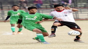 Footballers battling for getting hold of the ball during a match of 4th Sher-e-Kashmir Gold Cup at GGM Science College on Saturday.     -Excelsior/ Rakesh