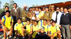 SSP Mohan Lal presenting Range Police Volleyball Friendship Cup to winning team at Sports Stadium, Kathua on Thursday.