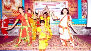 Children performing prayer during Christmas celebration function at Qasim Nagar in Jammu.
