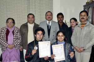 Medalists Heena and Inayat posing alongwith Director General Youth Services and Sports, Navin Aggarwal and other dignitaries in Jammu on Friday.