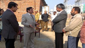 Income Tax Commissioner inspecting work on officers colony on Thursday.
