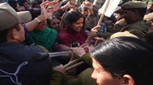 Police cops resisting selected jail warden candidates during protest march to Civil Secretariat at Jammu on Monday. 	—Excelsior/Rakesh
