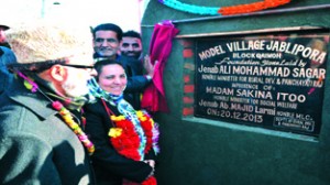 Minister for Panchayati Raj Ali Mohammad Sagar along with Minister for Social Welfare, Sakina Itoo laying foundation stone of Model village Jablipora in Anantnag district on Friday.  -Excelsior / Sajad Dar