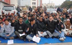 Employees staging protest dharna outside Divisional Commissioner's office in Jammu on Saturday.  —Excelsior/ Rakesh