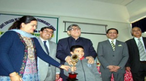 Minister for Higher Education Mohd  Akbar Lone distributing prize to a winner at GCET on Saturday.