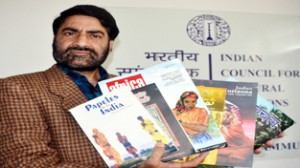 ICCR Regional Director Balwant Thakur displaying six international journals on Thursday.