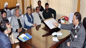 Transporters holding meeting with Transport Minister Ch Ramzan in Jammu on Tuesday.