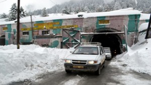 Stranded vehicles coming out of Jawahar Tunnel after re-opening of Jammu-Srinagar National Highway on Thursday. -Excelsior/Sajad Dar