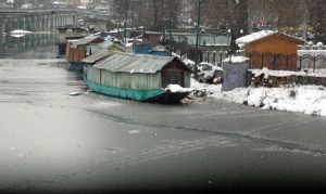 A view of world famous Dal Lake in Srinagar on Sunday where portion of the lake froze as chilly conditions further intensified. (UNI)