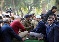 Delhi Chief Minister Arvind Kejriwal with Cabinet colleague Manish Sisodia and others sitting on a dharna demanding action against erring police officials in New Delhi on Monday. (UNI)