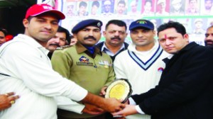 Amrinder of Haryana Police receiving man of the match award from SP Kathua Mohan Lal on Tuesday.