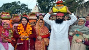 Devotees taking out Kalash yatra at village Gho Brahmana during Bhagwat Saptah Katha on Monday. -Excelsior/Gautam